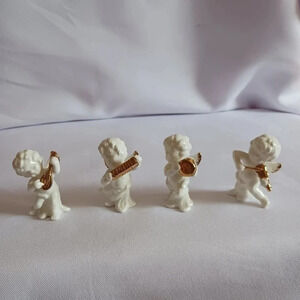 Bone china set of 4 angels gathered playing instruments